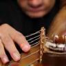 Renato Paes tocando berimbau